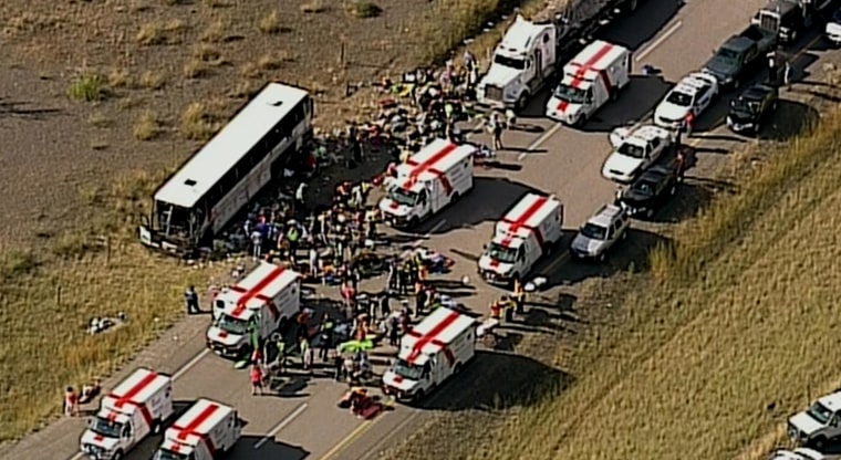 Image: Emergency personnel attend to people injured in a bus crash 20 miles south of Merritt, British Columbia, Canada.