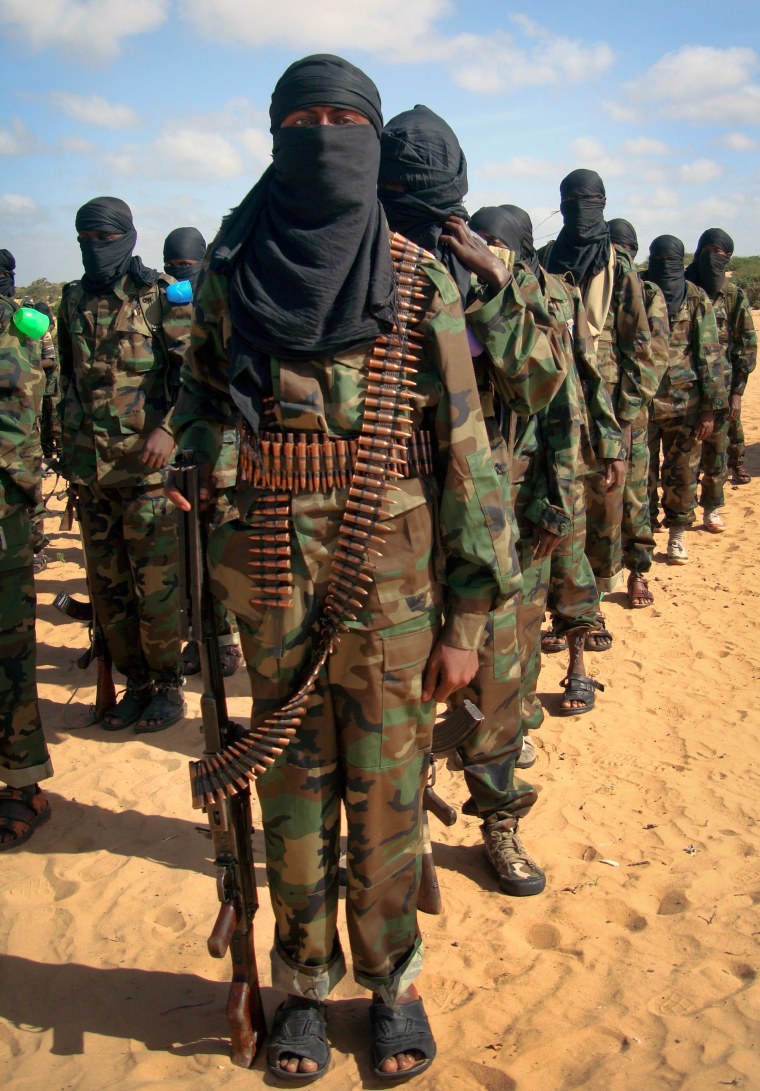 Image: Armed members of the militant group al-Shabab attend a rally on the outskirts of Mogadishu