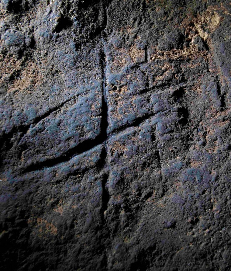 Image: Engravings believed to have been made by Neanderthals more than 39,000 years ago is pictured in Gorham's Cave