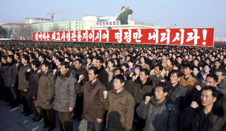 Image: KCNA picture shows North Korean citizens and soldiers attending a rally in Pyongyang
