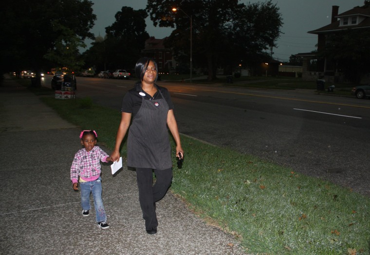 Latoya Caldwell, 31, walks her children to school at 7:30 a.m. before she spends an hour on the city bus to get to the Wendy’s where she works.