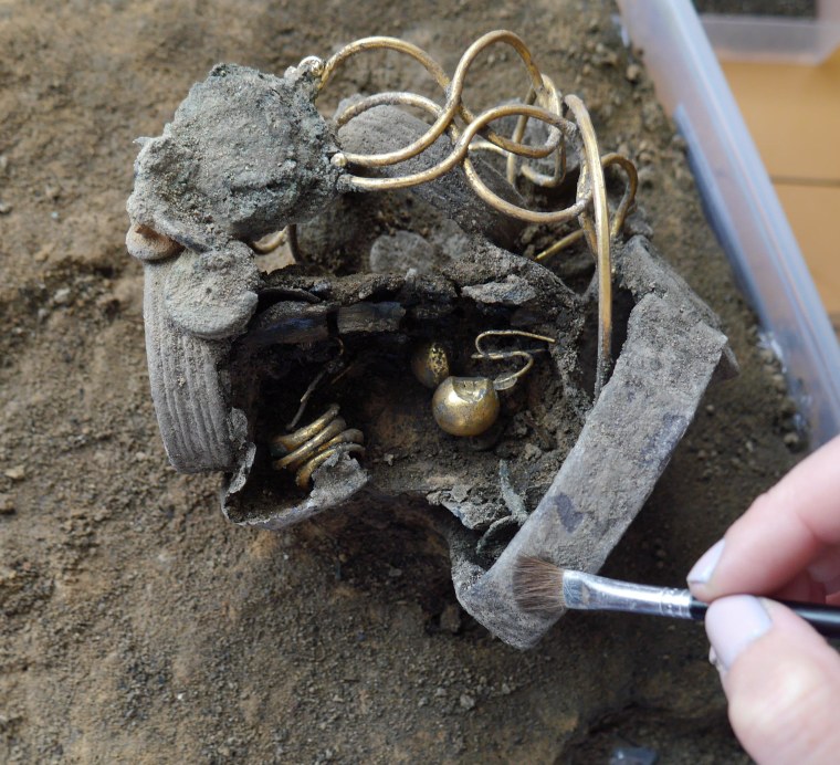 The Roman treasure trove discovered at Colchester includes silver and gold armlets, gold earrings and a bag of coins.