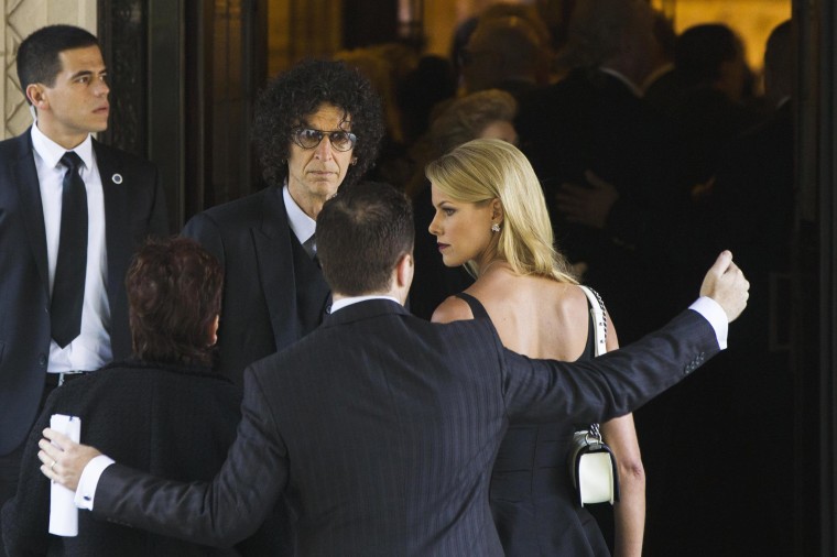 Image: Radio host Howard Stern arrives with wife Beth Ostrosky to attend the funeral of comedienne Joan Rivers at Temple Emanu-El in New York