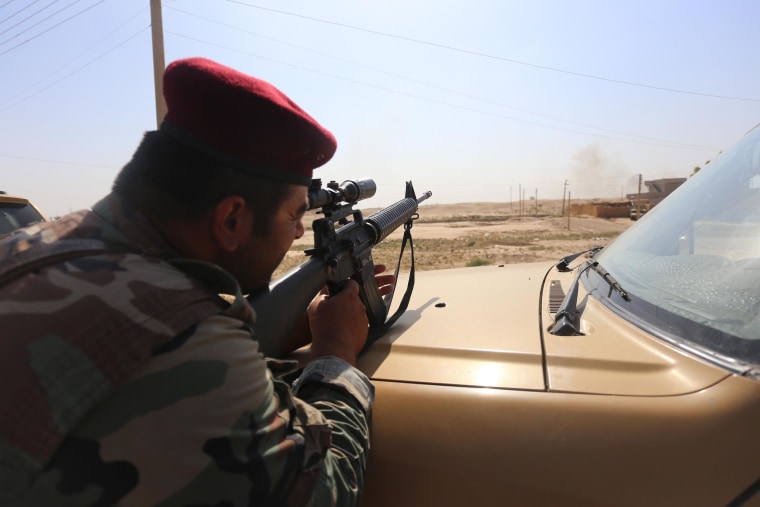 Image:  A Peshmerga targeting a point by a M16 in Al-Bakir neighborhood of Mosul, Iraq