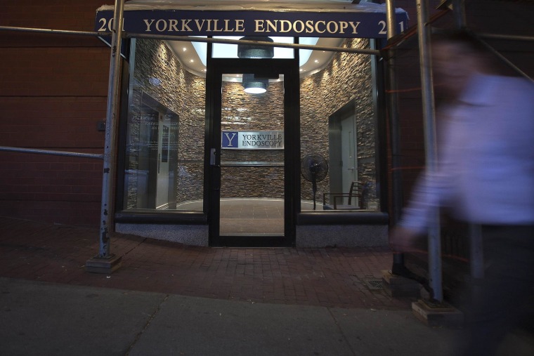 Image: A man walks past the Yorkville Endoscopy Clinic in the Manhattan borough of New York