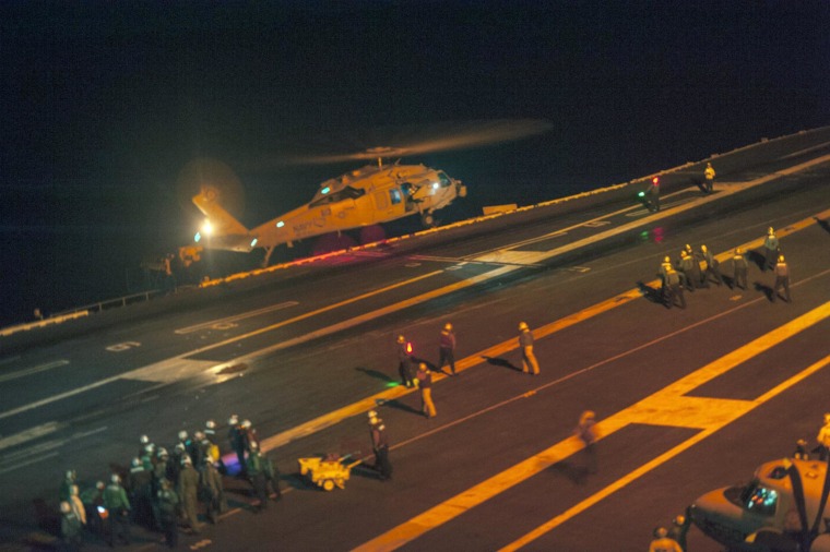 Image: A MH-60S Sea Hawk helicopter lands on the flight deck of the Nimitz-class aircraft carrier USS Carl Vinson