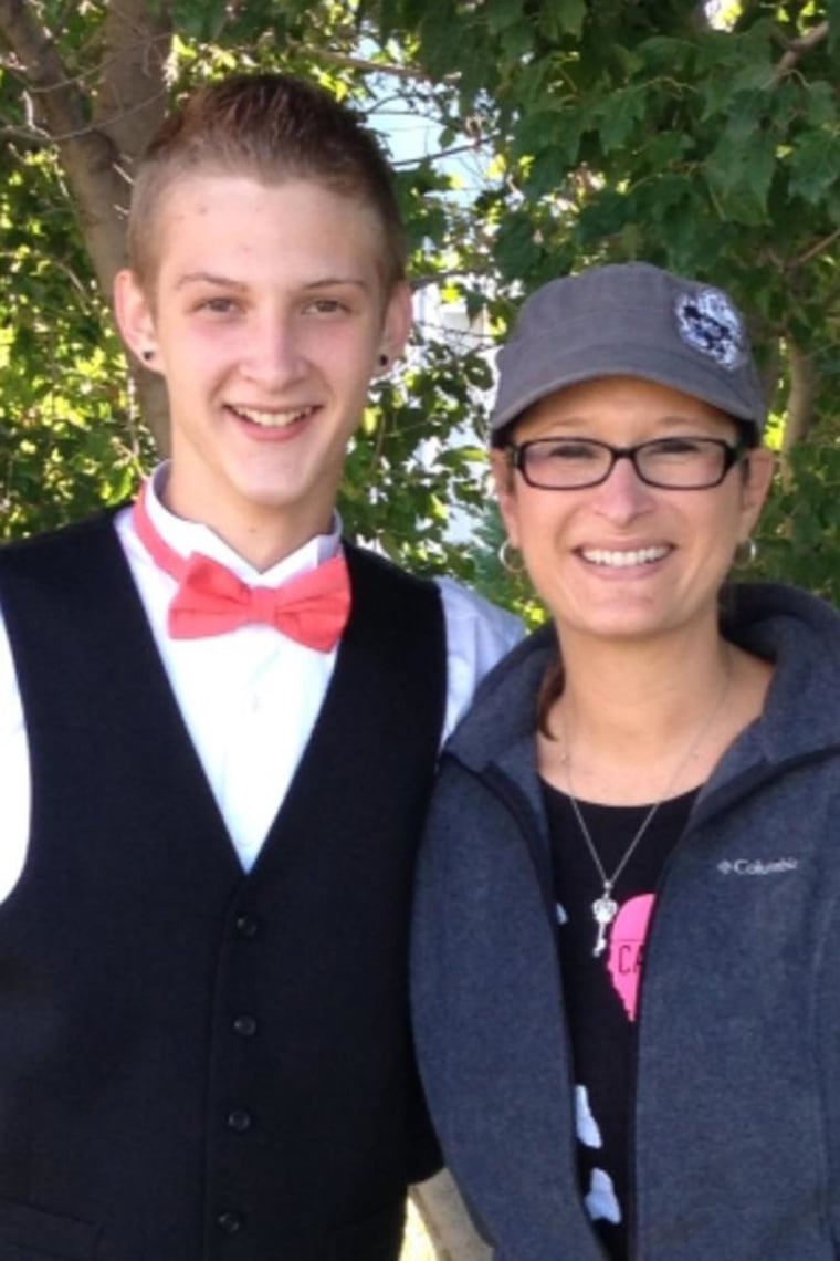 Image: 17-year-old Bryce Masters stands with his mother in an undated family photo.