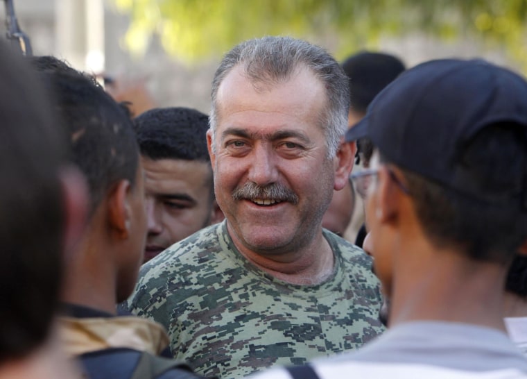 Colonel Abdul-Jabbar al-Aqidi, commander of the rebels’ Military Council in Aleppo, is seen among members of Ghurabaa al-Sham brigade in the Al-Sakhour neighborhood of Aleppo