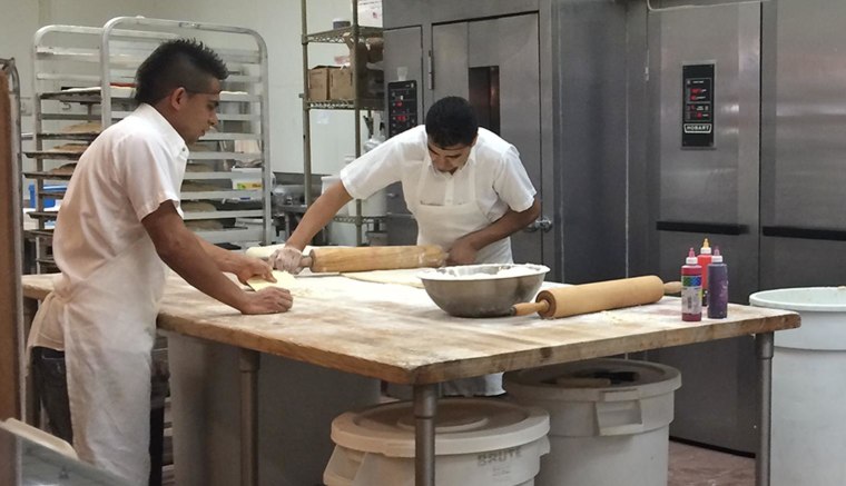 Workers at La Superior's tortilleria prepare corn tortillas made daily at the supermarket.