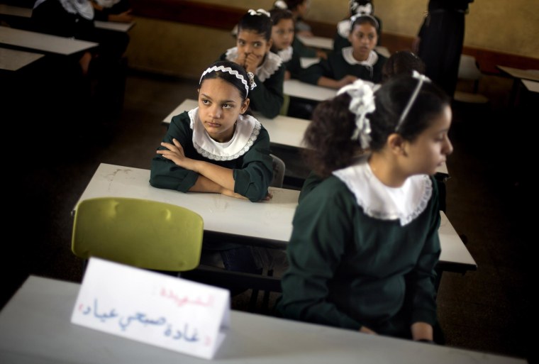 Image: Palestinian girls sit in a classroom in Gaza City on Sept. 14