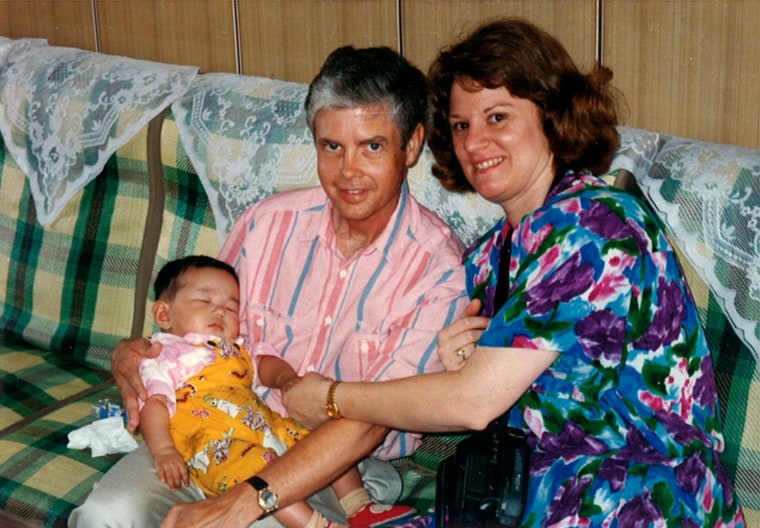 Image: Genevieve Norman with her adopted parents  taken in the orphanage parlor in Changzhou.