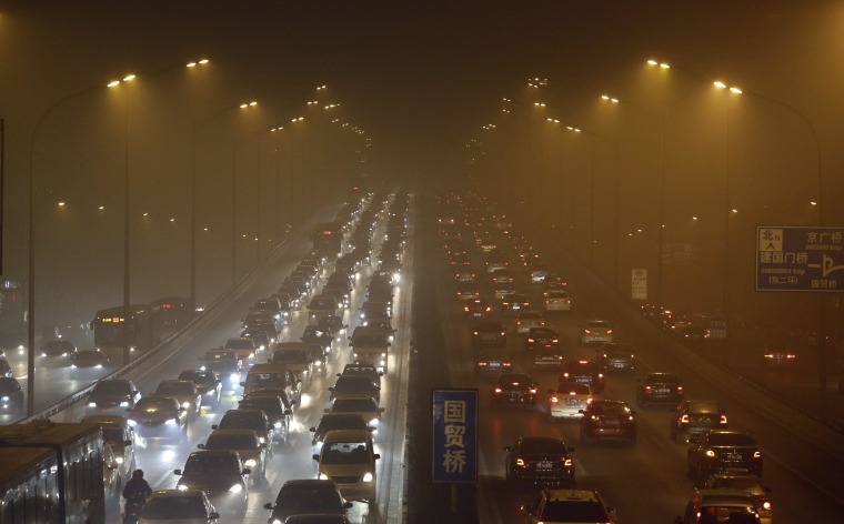 Image: File photo shows vehicles driving on the Third Ring Road on a very hazy winter day in Beijing