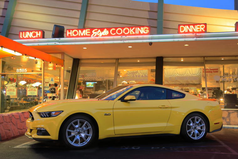 Muscle cars, such as the 2015 Ford Mustang pictured here, are going high-tech in an effort to boost mileage and keep power.