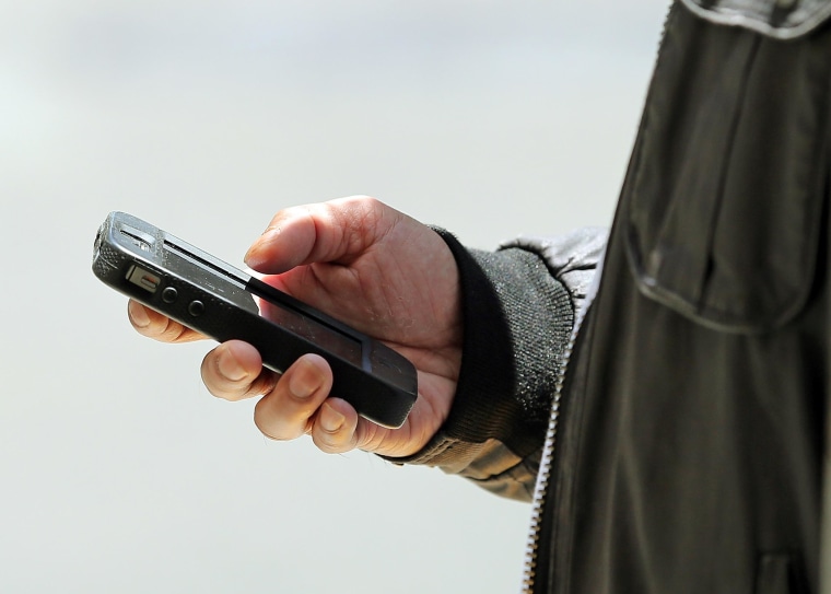 Image: Man uses smart phone
