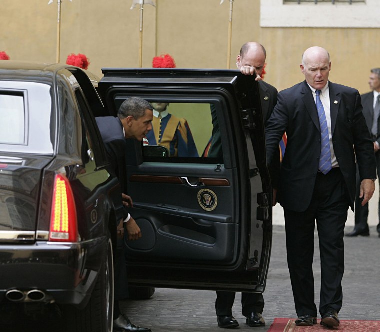 Secret Service Agent Joseph Clancy, right, holds the door open for President Barack Obama upon arrival at the Vatican for a meeting with Pope Benedict XVI on July 10, 2009. 