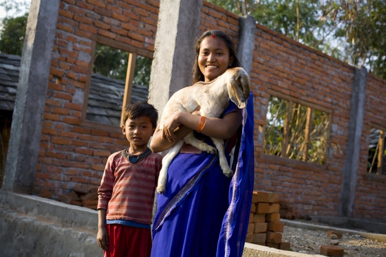 Image: Mandira Bote, a beneficiary of the Heifer Goat Project, pictured with her seven-year-old son Sanam Bote in Sarlahi, Nepal.