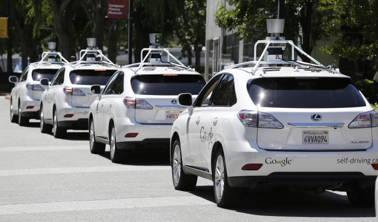 Image: A row of Google self-driving cars outside the Computer History Museum in Mountain View, Calif., on May 14.