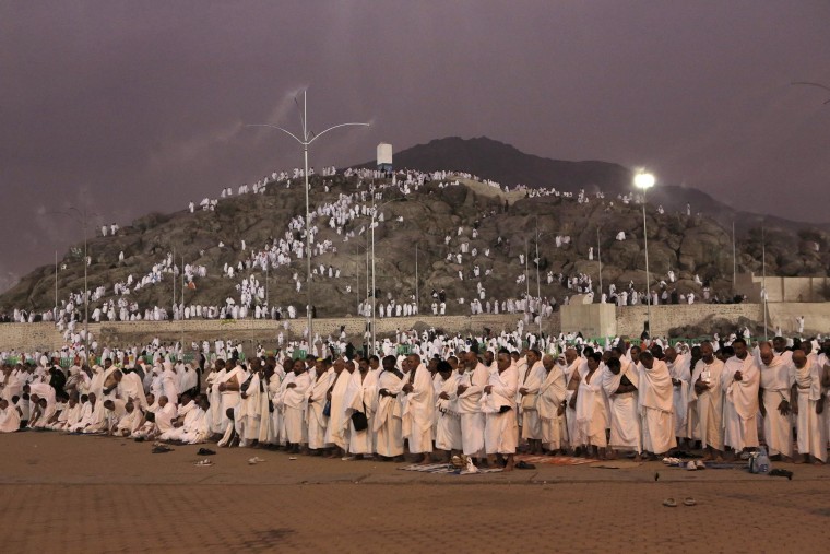 Image: Muslim pilgrims pray as the sun sets at the Plain of Arafat during the annual pilgrimage, known as the hajj,