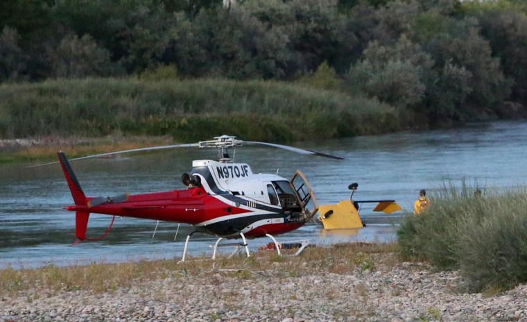Image: A yellow, two-seat helicopter crashed into the Colorado River Saturday evening