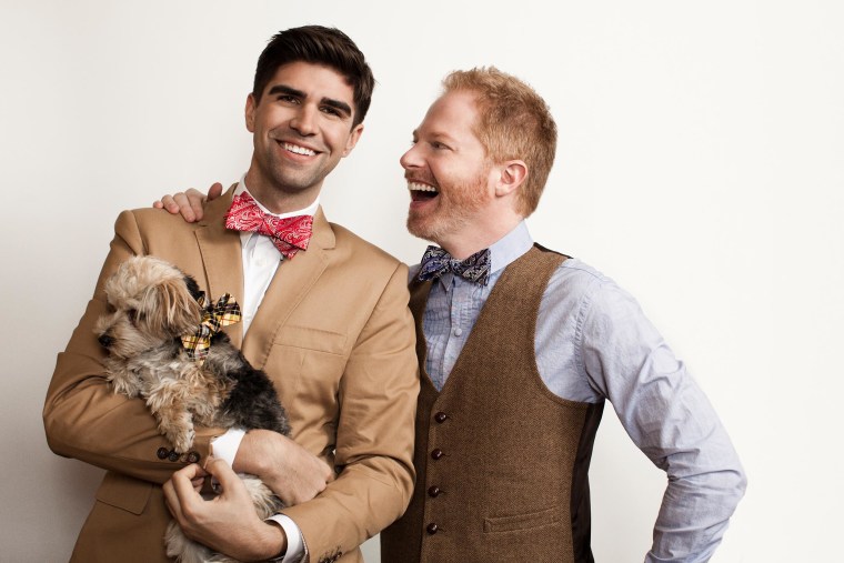 Image: Jesse Tyler Ferguson and  husband Justin Mikita, and their Morkie Leaf