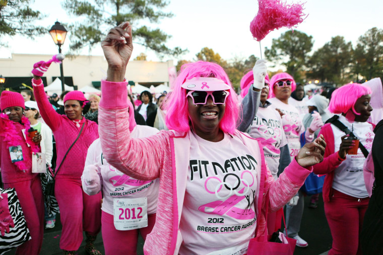 Image: A woman dances to warm up for the 20th Susan G. Komen Race for The Cure in Germantown, Tenn., on Oct. 27, 2012.