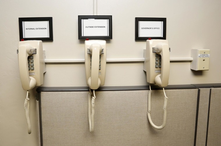 Image: A bank of phones on the wall of the operations room in the newly renovated death chamber