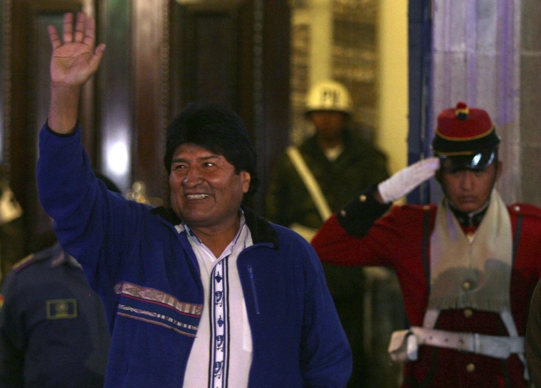Image: Bolivia's President Evo Morales waves to supporters at the entrance of the presidential palace in La Paz