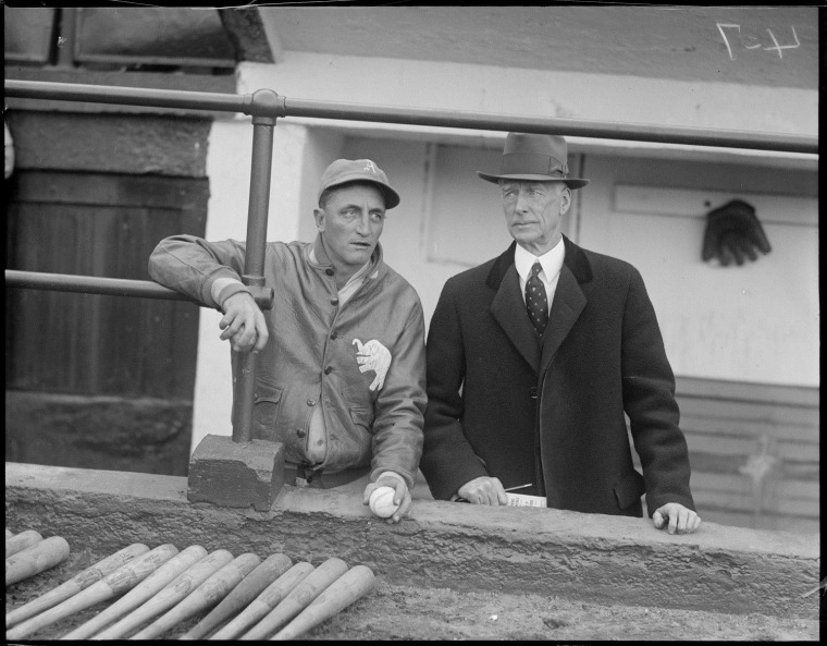 Image: Philadelphia Athletics coach Lena Blackburne, left, with manager Connie Mack