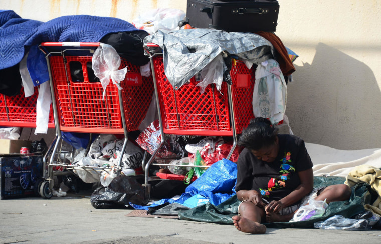 Image: A homeless woman