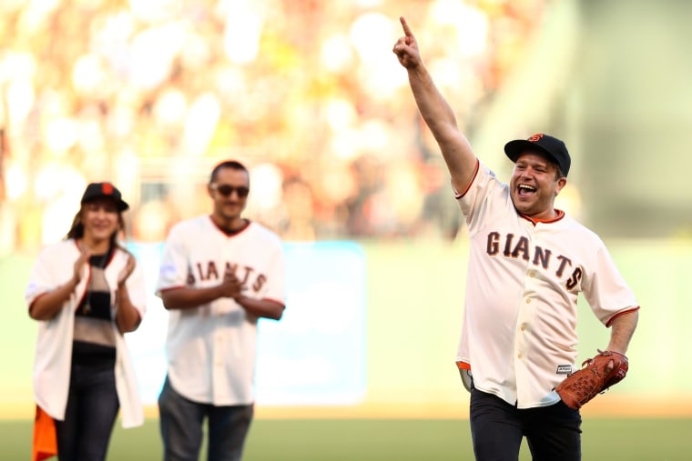 Image: Zak Williams, son of Robin Williams, throws out the ceremonial first pitch