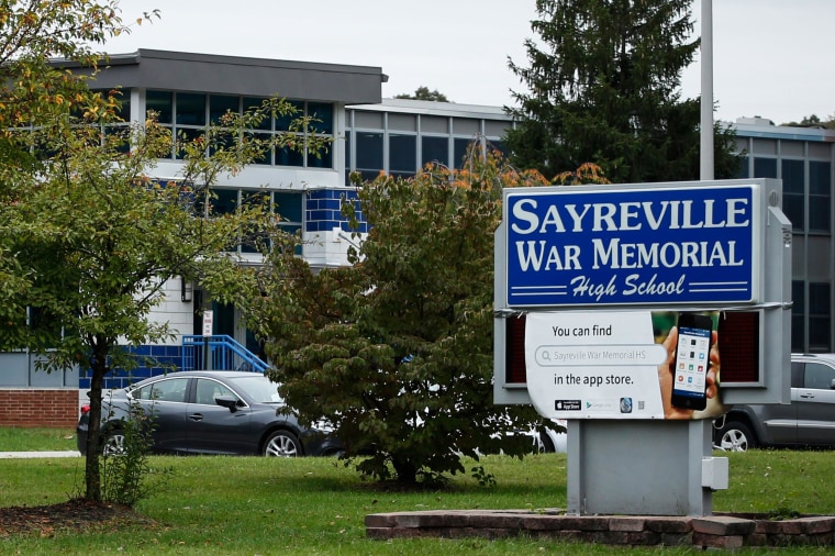 Image: A Sayreville War Memorial High School sign stands in front of the school