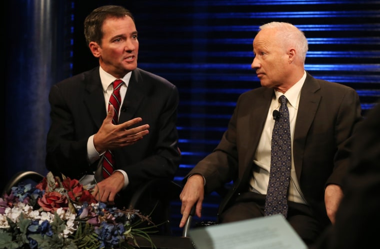 Democratic challenger Andrew Romanoff, left, makes point as his opponent, Republican incumbent Mike Coffman.