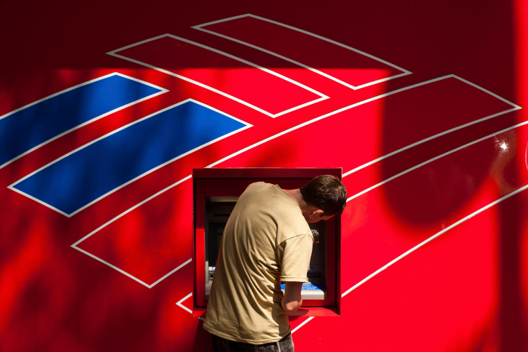 Image: A Bank of America customer uses a Bank of America ATM in Charlotte