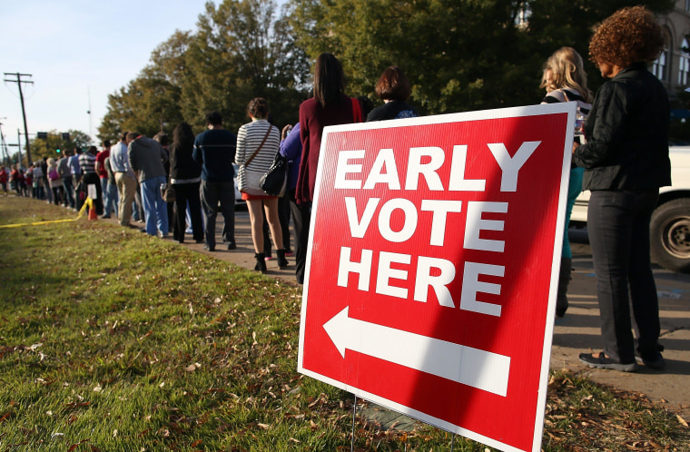 LITTLE ROCK, AR - NOVEMBER 03:  People line up for early voting outside of the Pulaski County Regional Building on November 3, 2014 in Little Rock, Arkansas. With one day to go before election day that has several very tight races for local and national office, hundreds of voters lined up for early voting.  (Photo by Justin Sullivan/Getty Images)