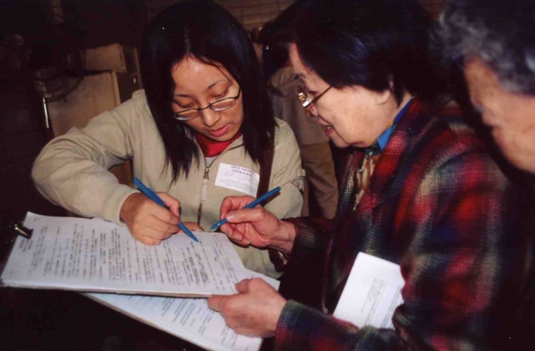 Volunteers from Asian American Legal Defense and Education Fund (AALDEF) conduct exit polling in 2000. 
