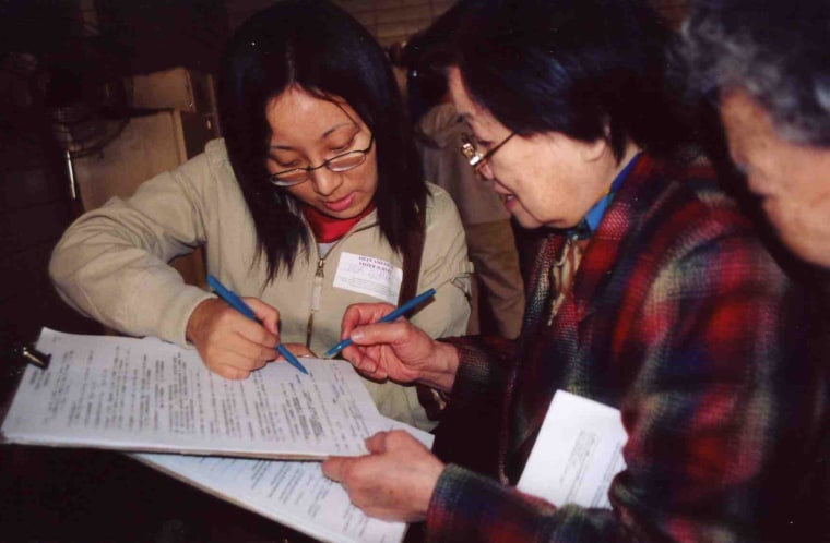 Volunteers from Asian American Legal Defense and Education Fund (AALDEF) conduct exit polling in 2000.