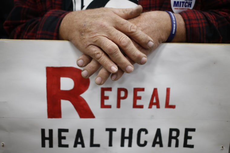 LOUISVILLE, KY - OCTOBER 31: Supporter James Hughes of Louisville, Ky. holds a sign calling for the repeal of the Affordable Care Act during a rally for Senate Minority Leader Mitch McConnell (R-KY) at Brandeis Machinery & Supply Company on October 31, 2014 in Louisville, Kentucky. With less than a week remaining until election day McConnell maintains a slight edge over Democratic challenger Kentucky Secretary of State Alison Lundergan Grimes in recent polls. (Photo by Luke Sharrett/Getty Images)