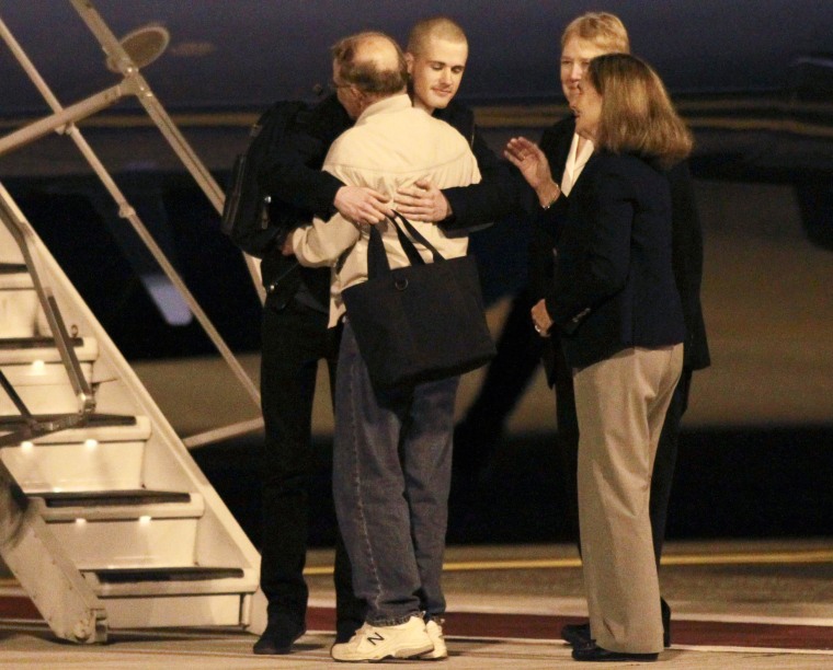 Image: American Matthew Todd Miller reunites with his family upon returning to the U.S. along with fellow prisoner Kenneth Bae at McChord Field at Joint Base Lewis-McChord,Washington