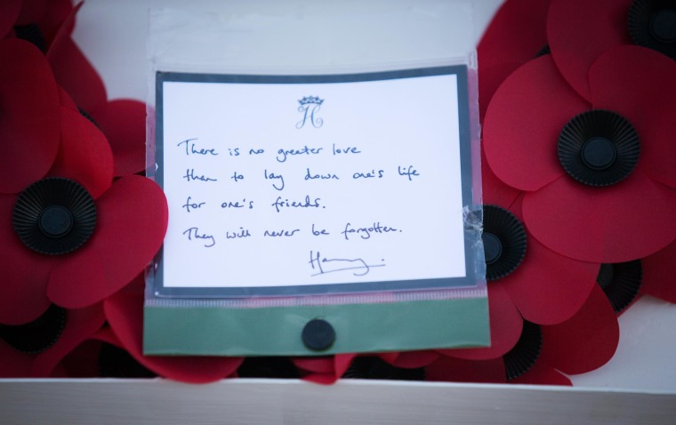 Image: A message on a poppy wreath laid by Prince Harry