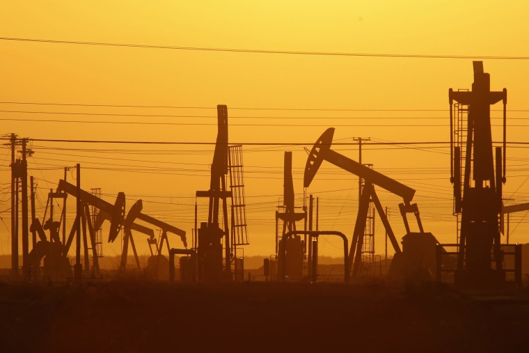 Image: Pump jacks are seen at dawn in an oil field over the Monterey Shale formation where gas and oil extraction using hydraulic fracturing, or fracking, is on the verge of a boom