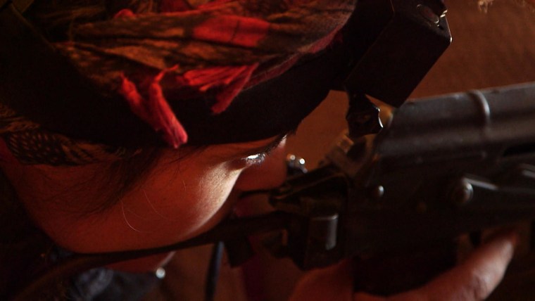 A female Kurdish sniper fighting against ISIS in the Syrian town of Kobane.