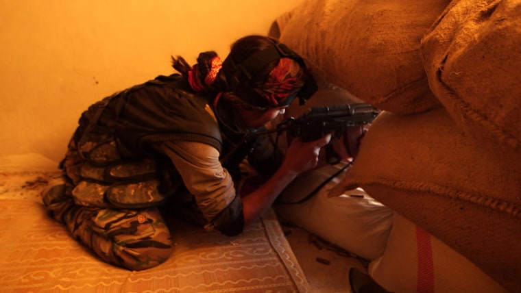 A female Kurdish sniper fighting against ISIS in the Syrian town of Kobani.