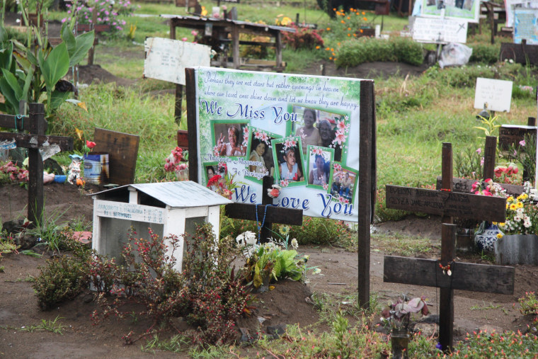 Mass grave in a churchyard outside of Tacloban, on Leyte, one year after Typhoon Haiyan.