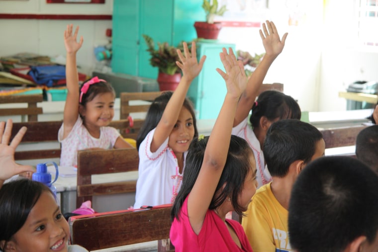 Students at Dulag SPED Central School interacting with Save the Children staff.