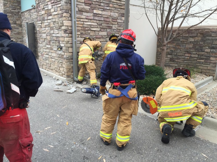 Image: Firefighters rescued a man from the wall of a Marshalls store in Longmont, Colo.