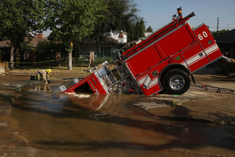 Image: Fire Truck Trapped In Giant Sinkhole