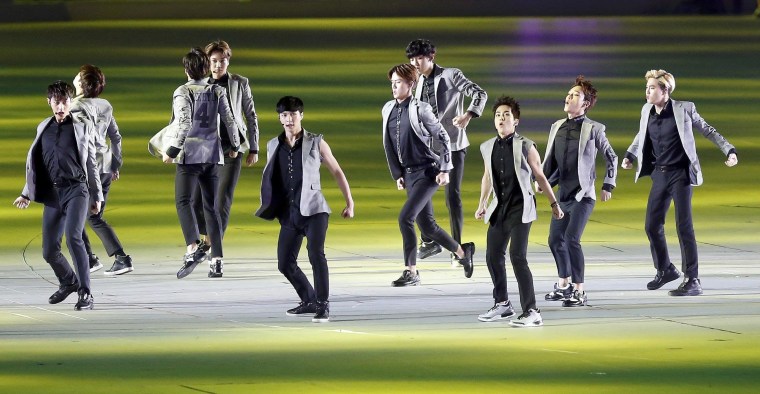 Image: K-pop boy band EXO perform during the Opening Ceremony of the 17th Asian Games in Incheon