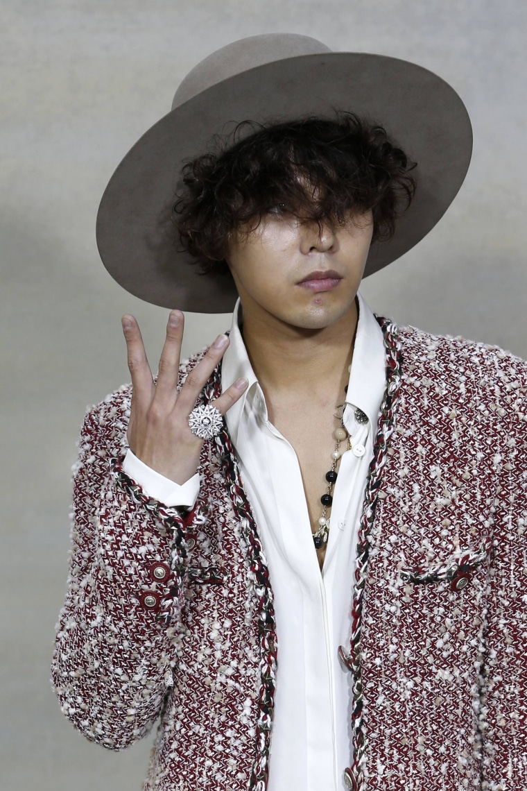 Image: South Korean artist Kwon Ji-yong, stage name G-Dragon, poses during a photocall before the German designer Karl Lagerfeld Spring/Summer 2015 women's ready-to-wear collection show for French fashion house Chanel in Paris