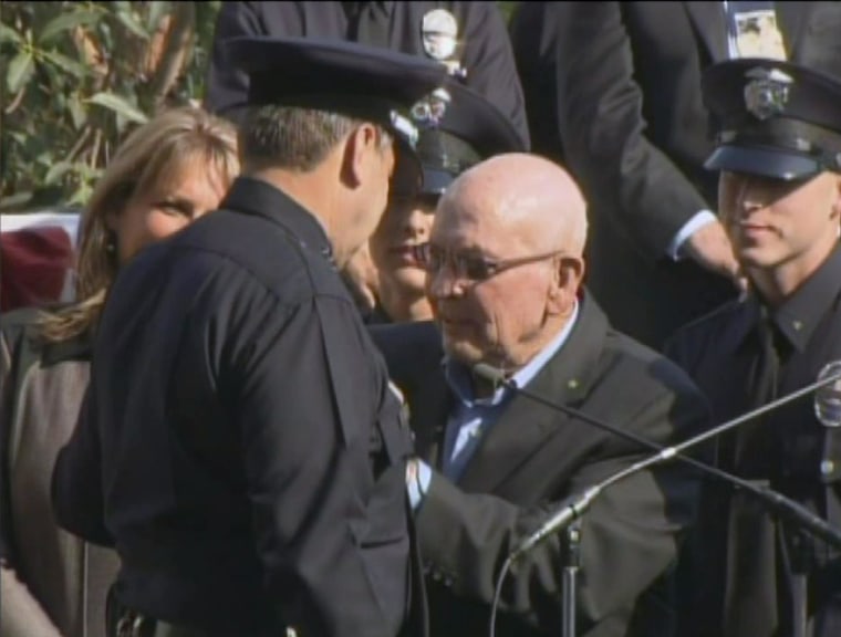Image: Charlie Beck is sworn in as LAPD chief in 2009 with the help of his father, George