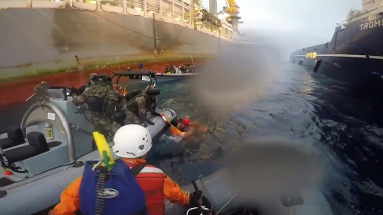 Image: Spanish Navy members rescue Greenpeace member
